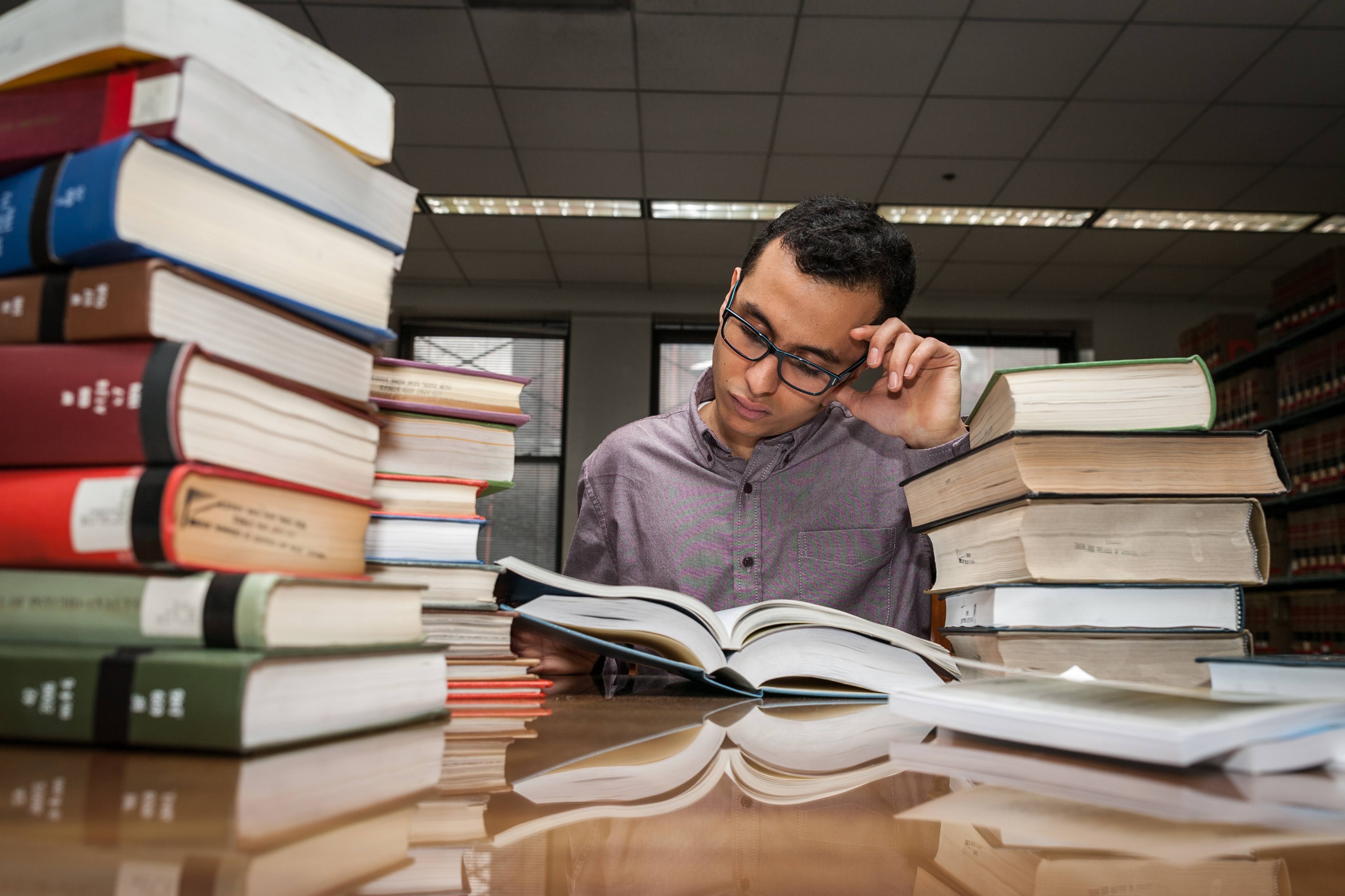 Person with books in library