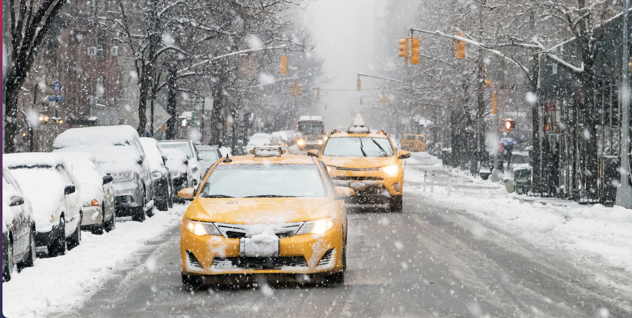 Image of Cabs Driving in New York City in the Snow